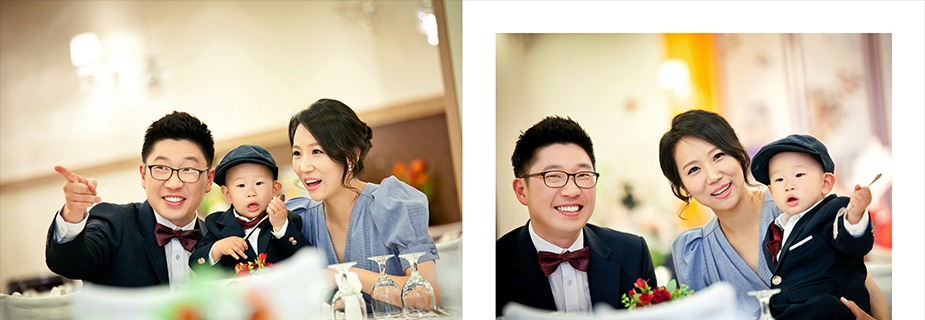 돌잔치홀 테이블에서 3인 가족 컷, 아빠 손가락질과 아이의 시선